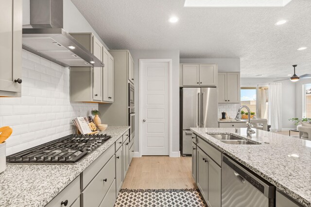 2520 Guadalupe Rd NE, Rio Rancho, NM 87144 - kitchen with stainless steel appliances, ventilation hood, gray cabinets, decorative backsplash, and a textured ceiling