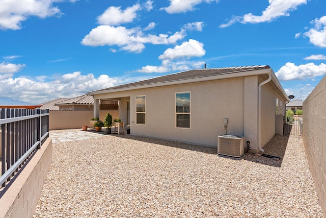 2520 Guadalupe Rd NE, Rio Rancho, NM 87144 - rear view of house featuring stucco siding, a fenced backyard, and a patio area