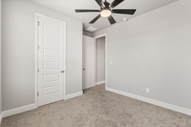2520 Guadalupe Rd NE, Rio Rancho, NM 87144 - unfurnished bedroom with carpet floors, a ceiling fan, and a textured ceiling