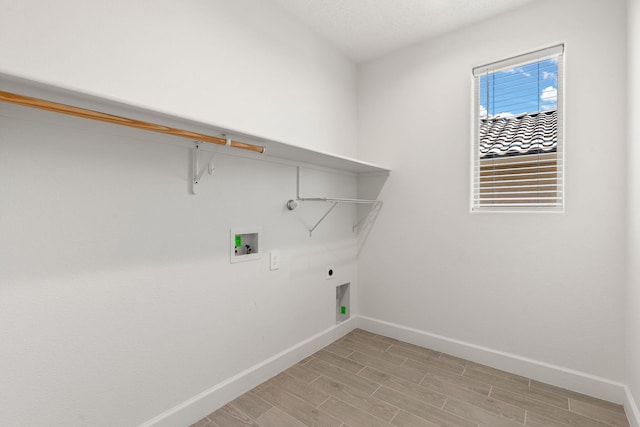 2520 Guadalupe Rd NE, Rio Rancho, NM 87144 - laundry area featuring hookup for an electric dryer, hookup for a washing machine, gas dryer hookup, and light wood-style flooring