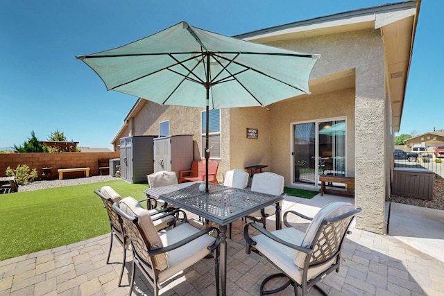 2332 Del Timbre Ln SW, Albuquerque, NM 87121 - fenced backyard with a patio area, outdoor dining area, and a storage shed