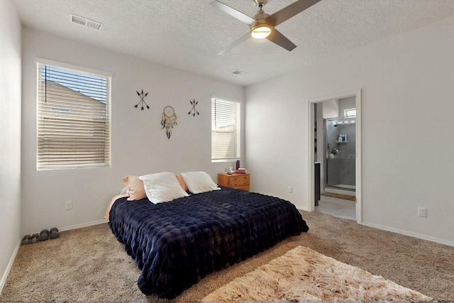 2332 Del Timbre Ln SW, Albuquerque, NM 87121 - carpeted bedroom featuring a textured ceiling, connected bathroom, and a ceiling fan