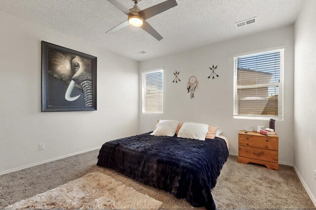 2332 Del Timbre Ln SW, Albuquerque, NM 87121 - bedroom featuring carpet floors, a textured ceiling, and ceiling fan