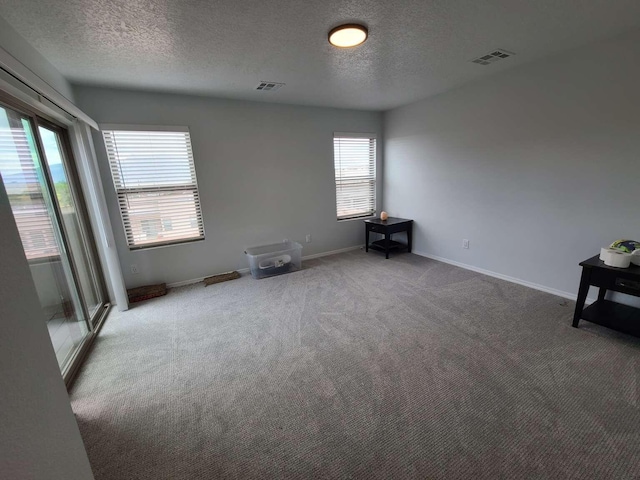 4300 Lauren NE, Rio Rancho, NM 87124 - spare room featuring a textured ceiling and carpet