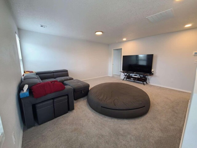 4300 Lauren NE, Rio Rancho, NM 87124 - carpeted living area featuring a textured ceiling and recessed lighting