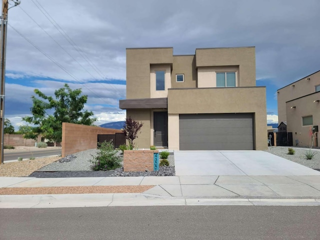 4300 Lauren NE, Rio Rancho, NM 87124 - modern home with stucco siding, driveway, and a garage