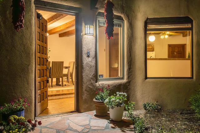2505 Elfego Rd NW, Albuquerque, NM 87107 - entrance to property featuring stucco siding, covered porch, and washer / clothes dryer