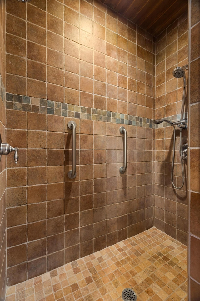 2505 Elfego Rd NW, Albuquerque, NM 87107 - bathroom featuring tiled shower and wooden ceiling