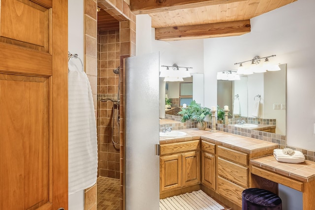 2505 Elfego Rd NW, Albuquerque, NM 87107 - bathroom featuring a tile shower, vanity, and a wooden ceiling with exposed beams