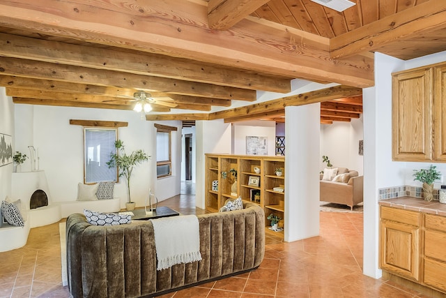 2505 Elfego Rd NW, Albuquerque, NM 87107 - living area featuring light tile patterned floors, a wood ceiling with exposed beams, and a ceiling fan