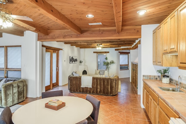 2505 Elfego Rd NW, Albuquerque, NM 87107 - dining room with ceiling fan, a wood ceiling with exposed beams, plenty of natural light, light tile patterned floors, and recessed lighting