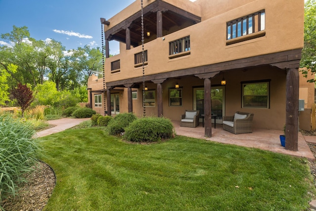 2505 Elfego Rd NW, Albuquerque, NM 87107 - back of property with a yard, stucco siding, a patio area, and outdoor lounge area