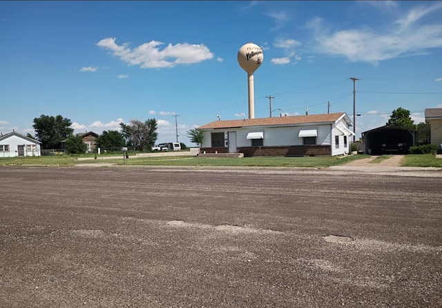 714 Locust St, Clayton, NM 88415 - view of building exterior featuring a detached carport