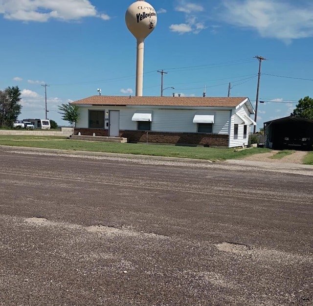 714 Locust St, Clayton, NM 88415 - view of building exterior with a carport