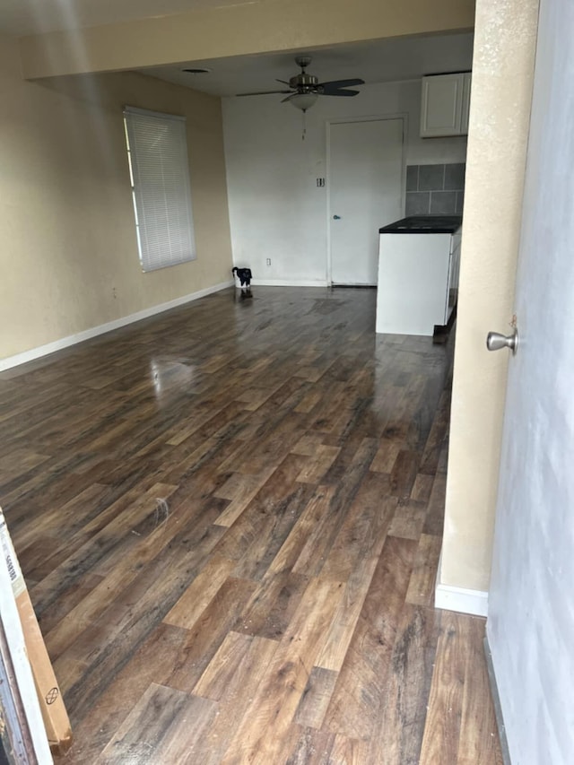 714 Locust St, Clayton, NM 88415 - spare room featuring dark wood finished floors and ceiling fan