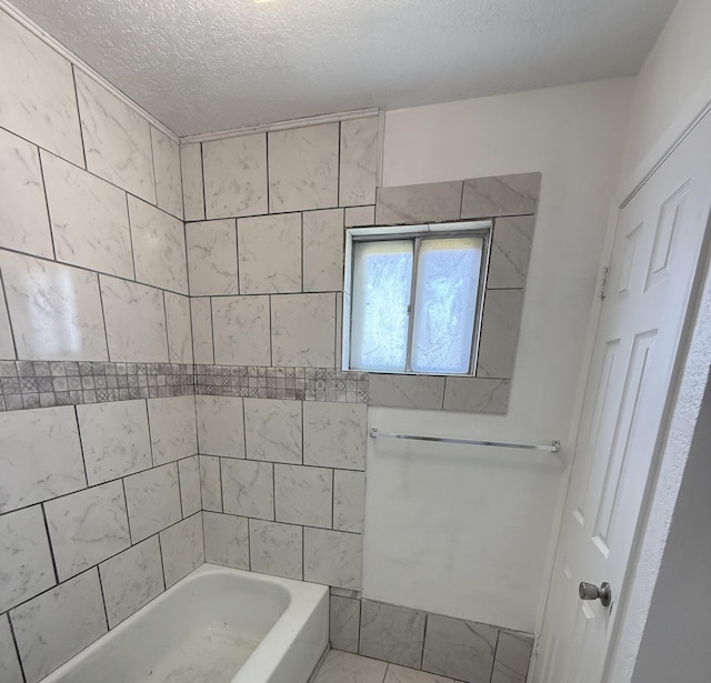714 Locust St, Clayton, NM 88415 - bathroom with a textured ceiling and washtub / shower combination