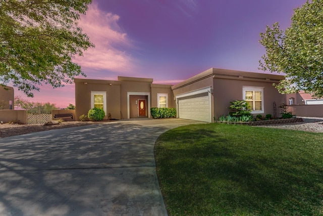 4104 Killington Rd NW, Albuquerque, NM 87114 - adobe home featuring stucco siding, driveway, a garage, and a front lawn