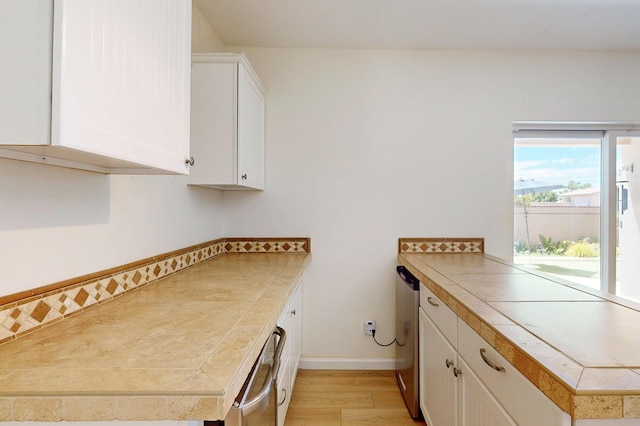 4104 Killington Rd NW, Albuquerque, NM 87114 - washroom featuring light wood-type flooring and baseboards