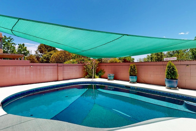 4104 Killington Rd NW, Albuquerque, NM 87114 - view of swimming pool featuring a fenced backyard