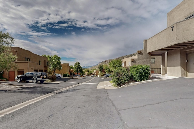 2900 Vista Del Rey NE Unit 7A, Albuquerque, NM 87112 - view of asphalt road featuring a residential view and a mountain view
