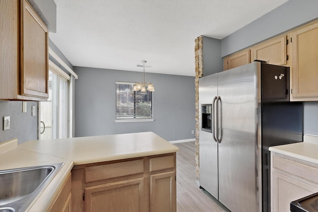 2900 Vista Del Rey NE Unit 7A, Albuquerque, NM 87112 - kitchen featuring stainless steel fridge, light wood finished floors, a peninsula, and light countertops