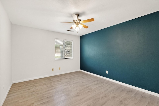 2900 Vista Del Rey NE Unit 7A, Albuquerque, NM 87112 - spare room featuring a ceiling fan and wood finished floors