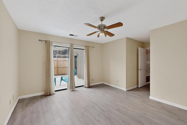 2900 Vista Del Rey NE Unit 7A, Albuquerque, NM 87112 - spare room featuring wood finished floors and a ceiling fan