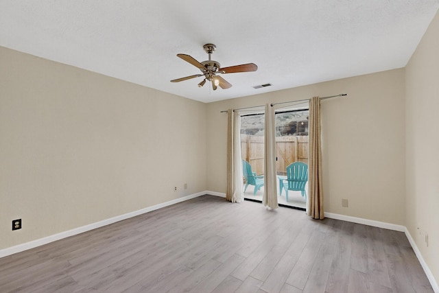 2900 Vista Del Rey NE Unit 7A, Albuquerque, NM 87112 - empty room with ceiling fan and wood finished floors