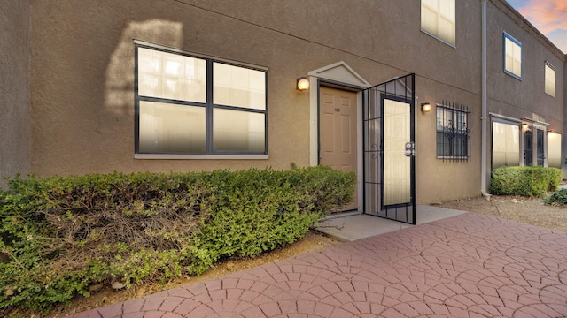 6041 Sequoia Rd NW Unit B3, Albuquerque, NM 87120 - view of exterior entry with stucco siding