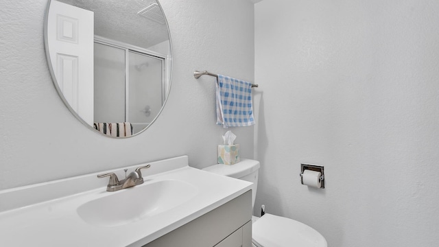 6041 Sequoia Rd NW Unit B3, Albuquerque, NM 87120 - bathroom featuring a stall shower, vanity, and a textured ceiling