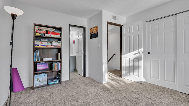 6041 Sequoia Rd NW Unit B3, Albuquerque, NM 87120 - bathroom featuring shower / bath combo with shower curtain, vanity, and a textured ceiling
