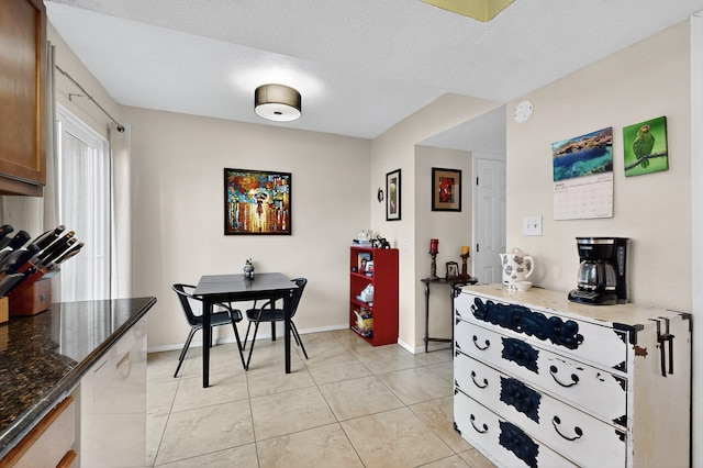700 Fruit Ave NW Unit G, Albuquerque, NM 87102 - dining area with light tile patterned floors and a textured ceiling
