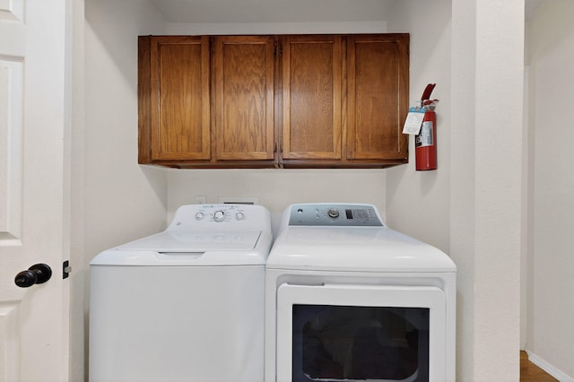 700 Fruit Ave NW Unit G, Albuquerque, NM 87102 - laundry room with washer and clothes dryer and cabinet space
