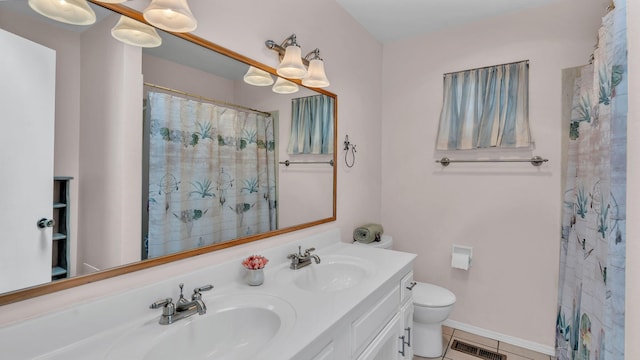 13101 Comanche Rd NE, Albuquerque, NM 87111 - full bath featuring double vanity, tile patterned flooring, and curtained shower