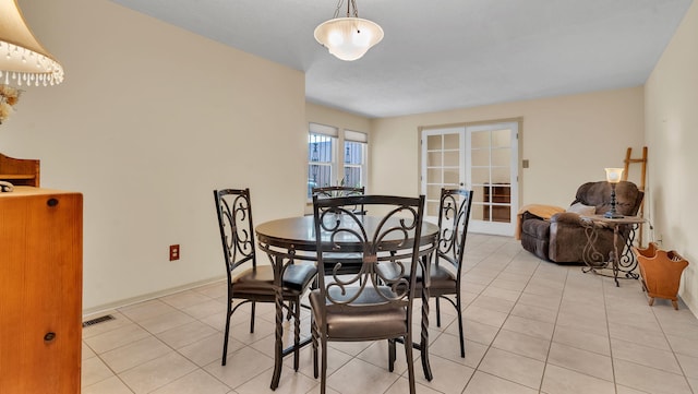 13101 Comanche Rd NE, Albuquerque, NM 87111 - dining space with french doors and light tile patterned flooring