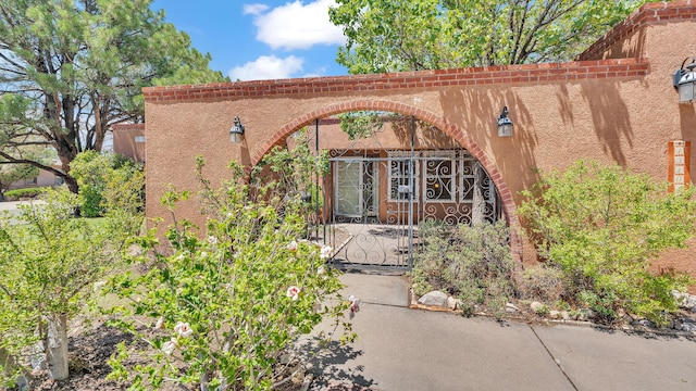 13101 Comanche Rd NE, Albuquerque, NM 87111 - view of exterior entry featuring a gate