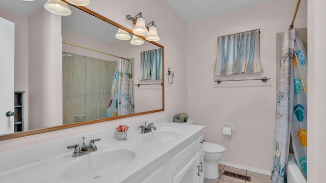 13101 Comanche Rd NE, Albuquerque, NM 87111 - full bathroom with double vanity, tile patterned flooring, and shower / tub combo