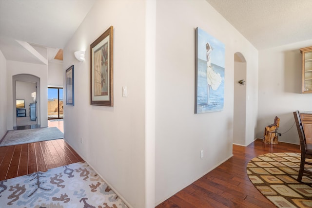 6615 Mountain Hawk Loop NE, Rio Rancho, NM 87144 - hallway with arched walkways and hardwood / wood-style flooring