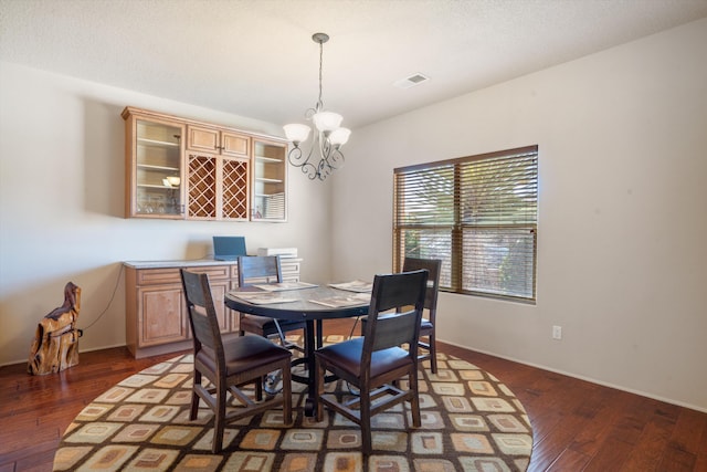 6615 Mountain Hawk Loop NE, Rio Rancho, NM 87144 - dining space with wood-type flooring and a chandelier