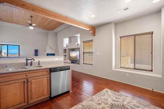 6615 Mountain Hawk Loop NE, Rio Rancho, NM 87144 - kitchen with dishwasher, beam ceiling, dark wood finished floors, brown cabinetry, and ceiling fan