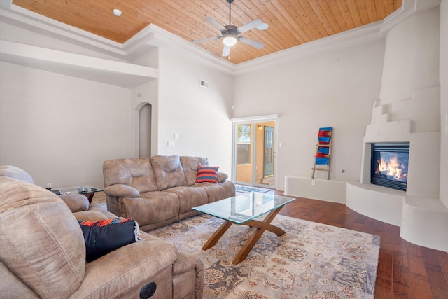 6615 Mountain Hawk Loop NE, Rio Rancho, NM 87144 - living room with wooden ceiling, ornamental molding, a glass covered fireplace, a high ceiling, and hardwood / wood-style floors