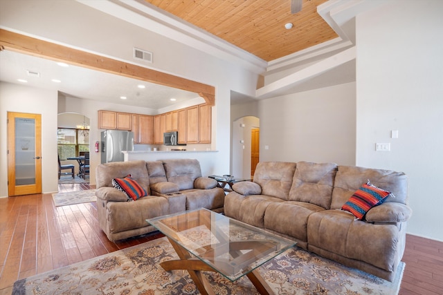 6615 Mountain Hawk Loop NE, Rio Rancho, NM 87144 - living area with arched walkways, hardwood / wood-style flooring, recessed lighting, wood ceiling, and a raised ceiling