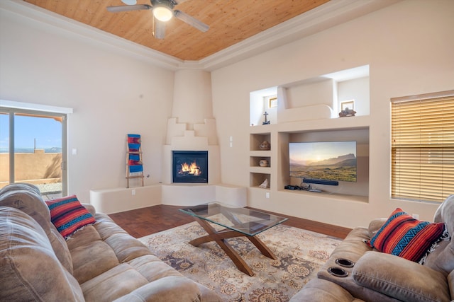 6615 Mountain Hawk Loop NE, Rio Rancho, NM 87144 - living room with wood ceiling, a large fireplace, ceiling fan, built in shelves, and wood finished floors