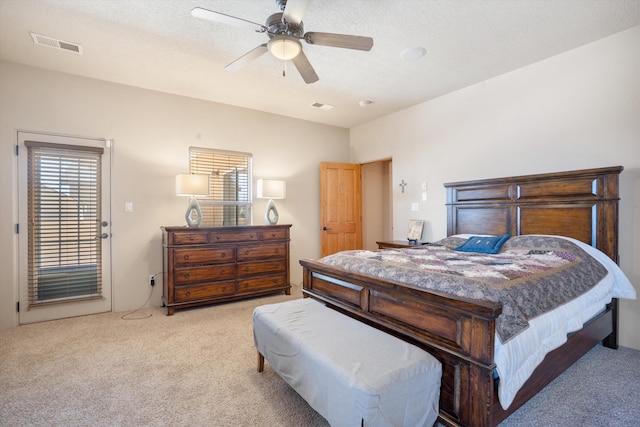 6615 Mountain Hawk Loop NE, Rio Rancho, NM 87144 - bedroom featuring light colored carpet, ceiling fan, and a textured ceiling