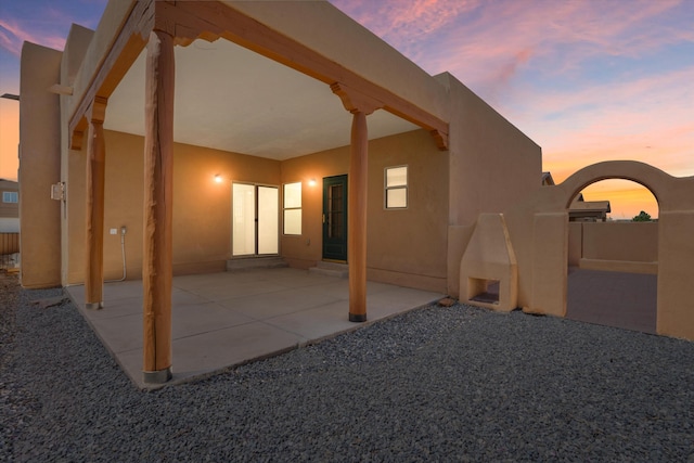 6615 Mountain Hawk Loop NE, Rio Rancho, NM 87144 - patio terrace at dusk featuring a patio area