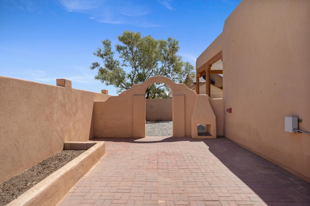 6615 Mountain Hawk Loop NE, Rio Rancho, NM 87144 - view of patio featuring a gate
