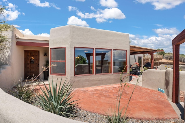 1524 W Meadowlark Ln, Corrales, NM 87048 - rear view of property featuring a patio and stucco siding