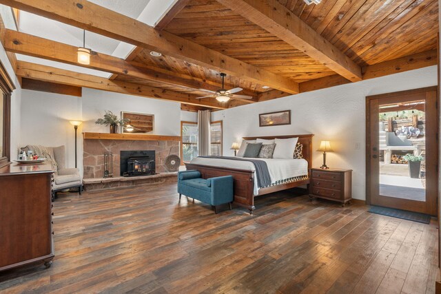 1524 W Meadowlark Ln, Corrales, NM 87048 - bedroom with dark wood-style floors, access to exterior, a fireplace, and a wooden ceiling with exposed beams