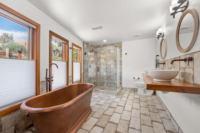 1524 W Meadowlark Ln, Corrales, NM 87048 - full bathroom featuring a stall shower, a freestanding tub, and vanity