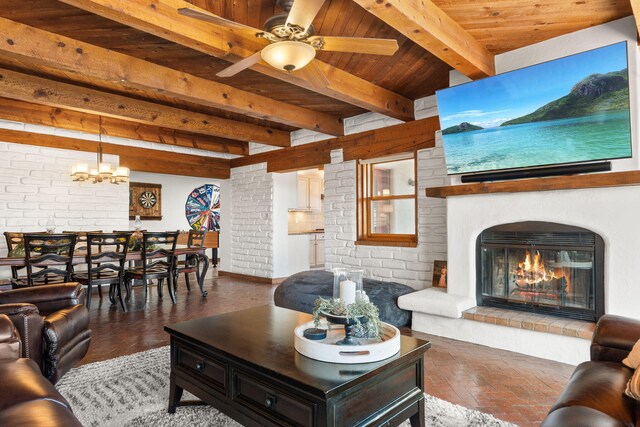 1524 W Meadowlark Ln, Corrales, NM 87048 - living room featuring a wood ceiling with exposed beams, a ceiling fan, and a glass covered fireplace